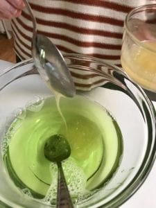 pouring honey into bowl