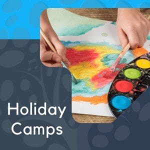 child painting at winter break camps